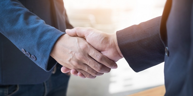 Two Confident Business Man Shaking Hands During A Meeting In The